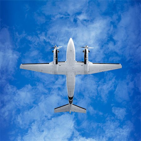 simsearch:400-04996557,k - Bottom view - twin prop cargo plane on sky background Stock Photo - Budget Royalty-Free & Subscription, Code: 400-07298661