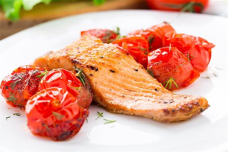 Salmon with roasted tomatoes on a plate Stock Photo - Budget Royalty-Free & Subscription, Code: 400-07291948