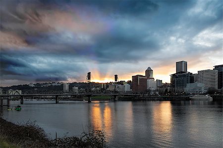 simsearch:400-07424733,k - Sunset Over Portland Oregon Downtown Along Willamette River with Sun Rays and Clouds Between Hawthorne Bridge Stock Photo - Budget Royalty-Free & Subscription, Code: 400-07304816