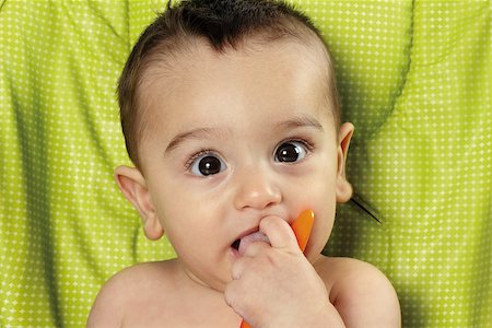 simsearch:400-05153083,k - Baby facing forward with fingers in mouth Stock Photo - Budget Royalty-Free & Subscription, Code: 400-07305535