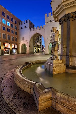 simsearch:400-07309915,k - Brunnenbuberl Fountain and Karlstor Gate in the Evening, Munich, Germany Stock Photo - Budget Royalty-Free & Subscription, Code: 400-07309909