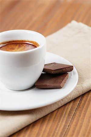 simsearch:400-07305144,k - freshly made espresso shot with chocolate, on wooden table Stock Photo - Budget Royalty-Free & Subscription, Code: 400-07301325