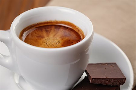 simsearch:400-07305144,k - freshly made espresso shot with chocolate, on wooden table Stock Photo - Budget Royalty-Free & Subscription, Code: 400-07301322