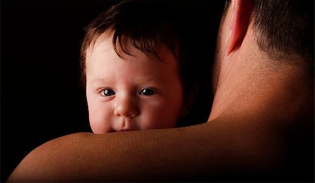 a father with a young child on a black background Stock Photo - Budget Royalty-Free & Subscription, Code: 400-07316027