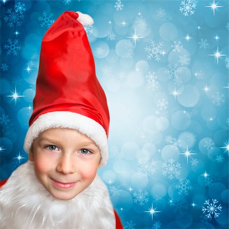 snowing on child in santa clothes Stock Photo - Budget Royalty-Free & Subscription, Code: 400-07312057