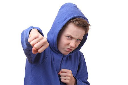 simsearch:400-06363059,k - Angry young boy throws a punch Stock Photo - Budget Royalty-Free & Subscription, Code: 400-07313480