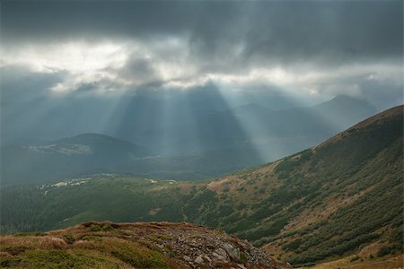 Landscape with sunbeams from clouds light the valley in the mountains Stock Photo - Budget Royalty-Free & Subscription, Code: 400-07313920