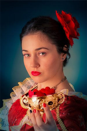 Portrait of a girl wearing a princess dress offering a bowl of heart shaped candy. Stock Photo - Budget Royalty-Free & Subscription, Code: 400-07325544
