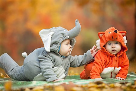 Two baby boys dressed in animal costumes in autumn park Stock Photo - Budget Royalty-Free & Subscription, Code: 400-07326164