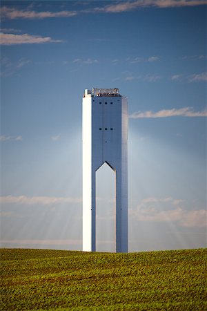 Solar Tower with rays  - thermo-solar power - blue sky and green grass - vertical Stock Photo - Budget Royalty-Free & Subscription, Code: 400-07326931