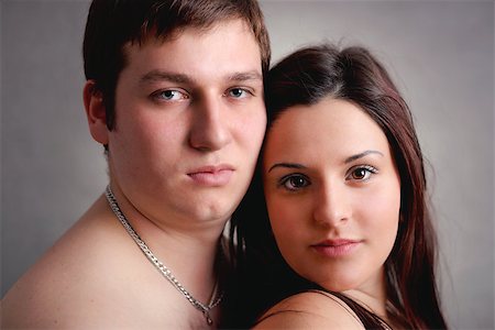 portrait of beautiful young couple on grey background Stock Photo - Budget Royalty-Free & Subscription, Code: 400-07328412