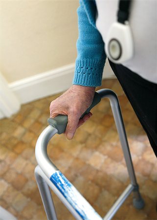 elder care - Old lady walking with walking frame wearing a personal alarm. Stock Photo - Budget Royalty-Free & Subscription, Code: 400-07328696
