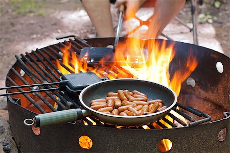 Frying small sausages over an open outdoor fire. Stock Photo - Budget Royalty-Free & Subscription, Code: 400-07328769