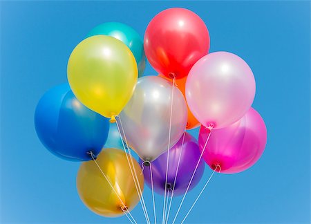 Bunch of colorful balloons in blue sky Stock Photo - Budget Royalty-Free & Subscription, Code: 400-07321559