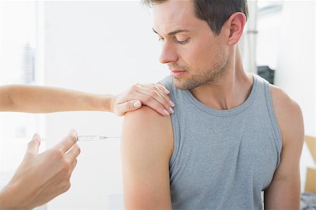 patient injection arm not children - Cropped image of doctor injecting man on arm in hospital Stock Photo - Budget Royalty-Free & Subscription, Code: 400-07335400