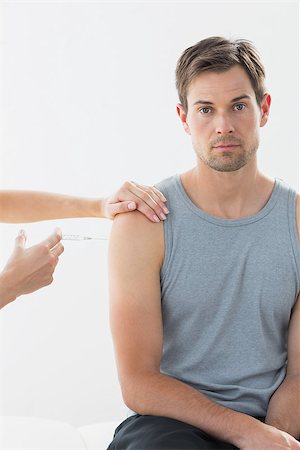 patient injection arm not children - Portrait of man receiving injection on arm in hospital Stock Photo - Budget Royalty-Free & Subscription, Code: 400-07335402