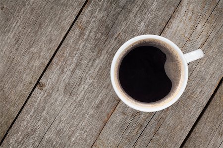 simsearch:400-07305144,k - Coffee cup on wooden table. View from above Stock Photo - Budget Royalty-Free & Subscription, Code: 400-07337829