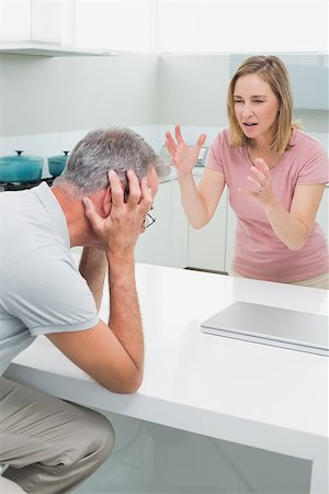 simsearch:6109-07601529,k - Unhappy couple having an argument in the kitchen at home Stock Photo - Budget Royalty-Free & Subscription, Code: 400-07339858