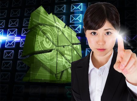 simsearch:614-02985267,k - Focused businesswoman pointing against glowing envelopes on black background Stock Photo - Budget Royalty-Free & Subscription, Code: 400-07339894