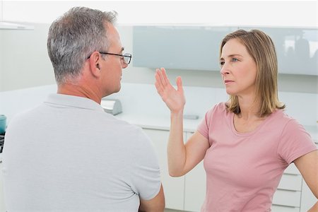 simsearch:6109-07601529,k - Unhappy couple having an argument in the kitchen at home Stock Photo - Budget Royalty-Free & Subscription, Code: 400-07339893