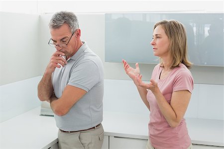 simsearch:6109-07601529,k - Unhappy couple having an argument in the kitchen at home Stock Photo - Budget Royalty-Free & Subscription, Code: 400-07339905