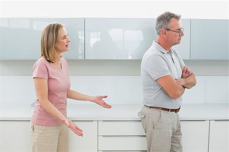 simsearch:6109-07601529,k - Unhappy couple having an argument in the kitchen at home Stock Photo - Budget Royalty-Free & Subscription, Code: 400-07339916