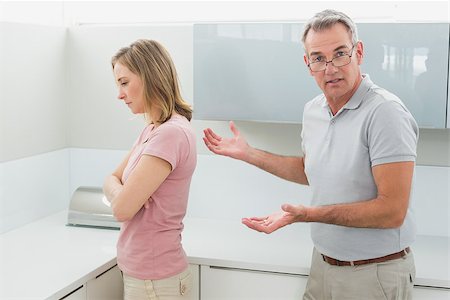 simsearch:6109-07601529,k - Unhappy couple having an argument in the kitchen at home Stock Photo - Budget Royalty-Free & Subscription, Code: 400-07339910
