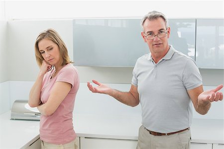 simsearch:6109-07601529,k - Unhappy couple having an argument in the kitchen at home Stock Photo - Budget Royalty-Free & Subscription, Code: 400-07339912