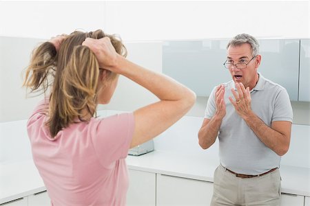 simsearch:6109-07601529,k - Unhappy couple having an argument in the kitchen at home Stock Photo - Budget Royalty-Free & Subscription, Code: 400-07339924