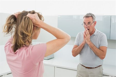 simsearch:6109-07601529,k - Unhappy couple having an argument in the kitchen at home Stock Photo - Budget Royalty-Free & Subscription, Code: 400-07339922