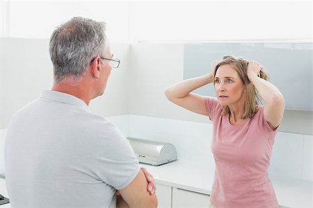 simsearch:6109-07601529,k - Unhappy couple having an argument in the kitchen at home Stock Photo - Budget Royalty-Free & Subscription, Code: 400-07339930