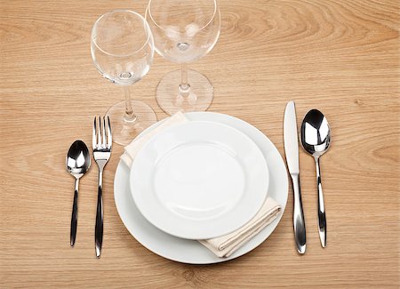 setting kitchen table - Empty plate, glasses and silverware set on wooden table Stock Photo - Budget Royalty-Free & Subscription, Code: 400-07331571