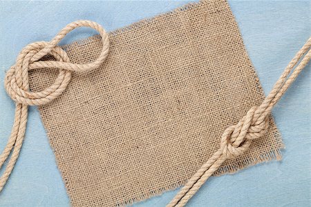 Ship rope with burlap on blue wooden texture background with copy space Stock Photo - Budget Royalty-Free & Subscription, Code: 400-07331643