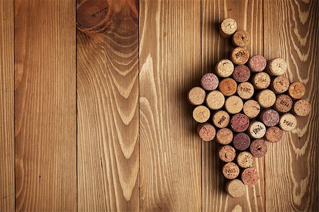 stopper - Grape shaped wine corks on wooden table background with copy space Stock Photo - Budget Royalty-Free & Subscription, Code: 400-07331667