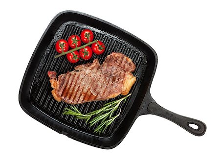 Sirloin steak with rosemary and cherry tomatoes cooking in a frying pan. Isolated on white background. View from above Stock Photo - Budget Royalty-Free & Subscription, Code: 400-07331672