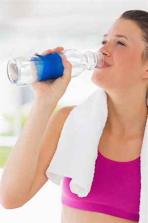 simsearch:400-05115517,k - Fit young woman with towel drinking water in the gym Stock Photo - Budget Royalty-Free & Subscription, Code: 400-07333040