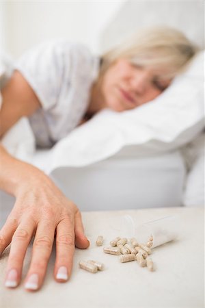 simsearch:693-03707745,k - Closeup of a mature woman sleeping in bed with pills in foreground at home Stock Photo - Budget Royalty-Free & Subscription, Code: 400-07333715