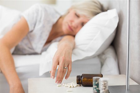 simsearch:693-03707745,k - Closeup of a mature woman sleeping in bed with pills in foreground at home Stock Photo - Budget Royalty-Free & Subscription, Code: 400-07333719