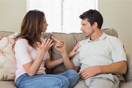 simsearch:400-07343634,k - Unhappy couple having an argument in living room at home Stock Photo - Budget Royalty-Free & Subscription, Code: 400-07346930