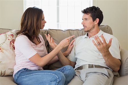 simsearch:400-07343634,k - Unhappy couple having an argument in living room at home Stock Photo - Budget Royalty-Free & Subscription, Code: 400-07346942