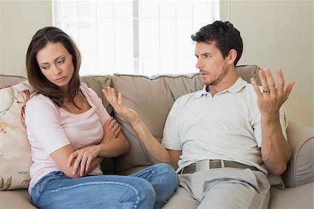 simsearch:400-07343634,k - Unhappy couple having an argument in living room at home Stock Photo - Budget Royalty-Free & Subscription, Code: 400-07346958