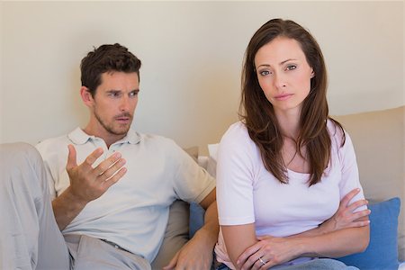 simsearch:400-07343634,k - Unhappy couple having an argument in living room at home Stock Photo - Budget Royalty-Free & Subscription, Code: 400-07346986