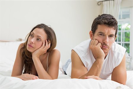 simsearch:400-07343634,k - Unhappy couple not talking after an argument in bed at home Stock Photo - Budget Royalty-Free & Subscription, Code: 400-07347560