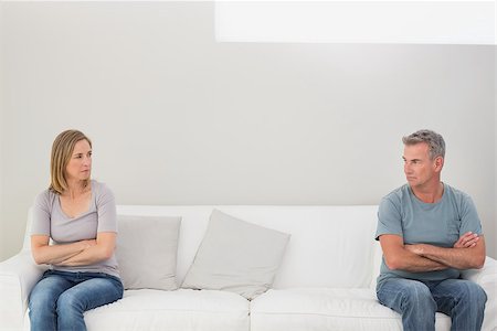 simsearch:400-07343634,k - Unhappy couple not talking after an argument in the living room at home Stock Photo - Budget Royalty-Free & Subscription, Code: 400-07340504