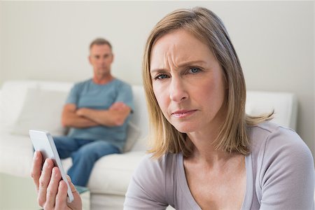 simsearch:400-07343634,k - Unhappy couple not talking after an argument in the living room at home Stock Photo - Budget Royalty-Free & Subscription, Code: 400-07340514