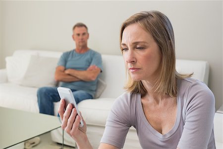 simsearch:400-07343634,k - Unhappy couple not talking after an argument in the living room at home Stock Photo - Budget Royalty-Free & Subscription, Code: 400-07340512