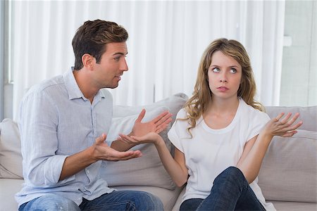 simsearch:400-07343634,k - Unhappy couple having an argument in living room at home Stock Photo - Budget Royalty-Free & Subscription, Code: 400-07343174