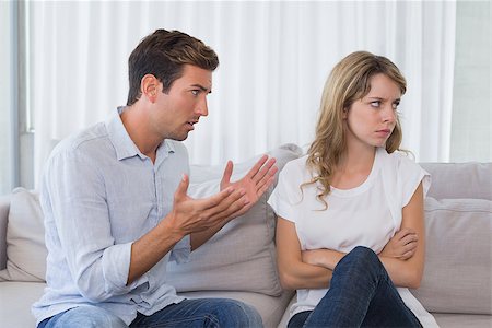 simsearch:400-07343634,k - Unhappy couple having an argument in living room at home Stock Photo - Budget Royalty-Free & Subscription, Code: 400-07343180