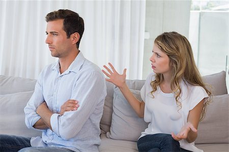 simsearch:400-07343634,k - Unhappy couple having an argument in living room at home Stock Photo - Budget Royalty-Free & Subscription, Code: 400-07343209