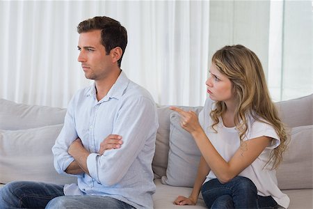 simsearch:400-07343634,k - Unhappy couple having an argument in living room at home Stock Photo - Budget Royalty-Free & Subscription, Code: 400-07343219